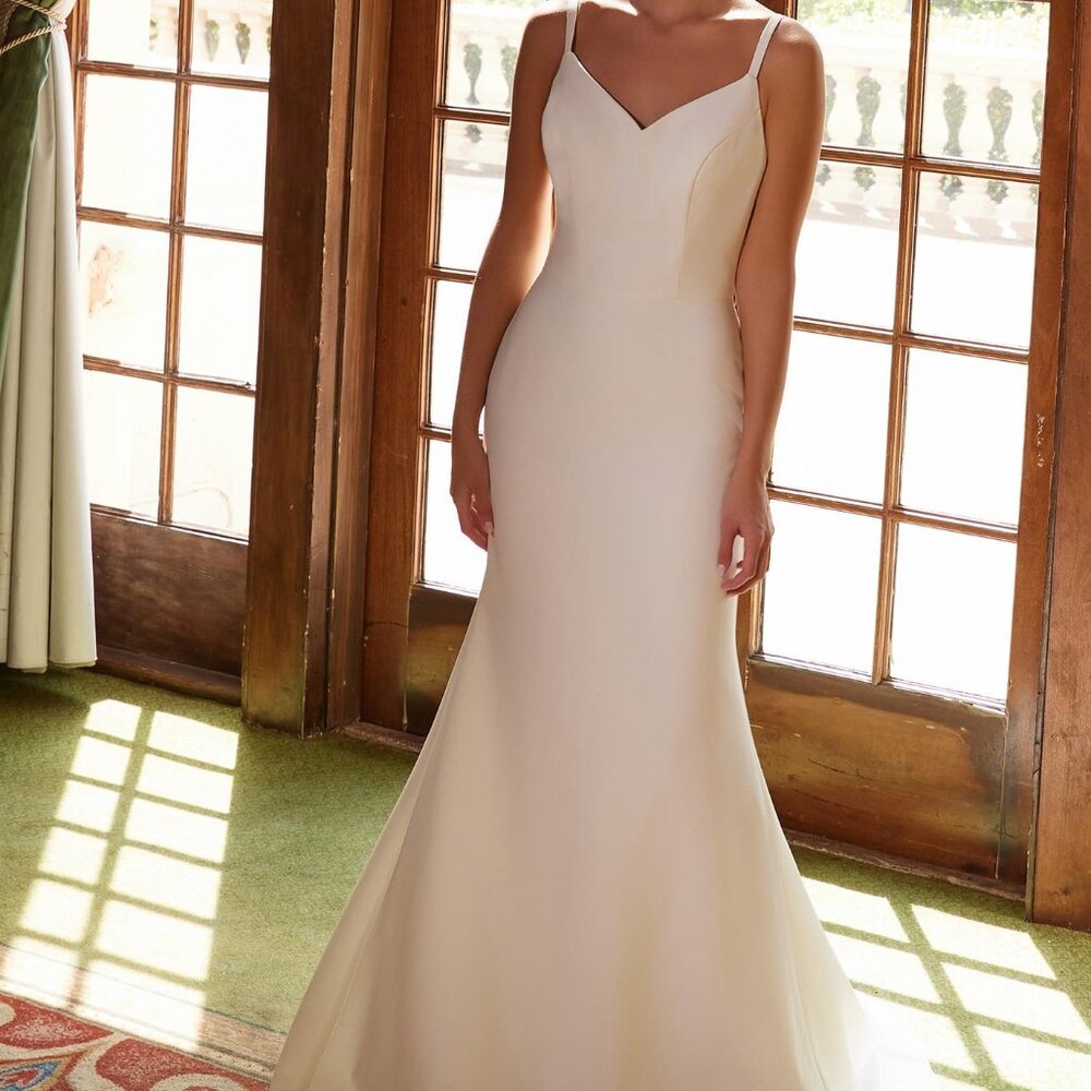 Wedding dress with long 3/4 sleeve jacket. Stretch satin fitted bridal gown